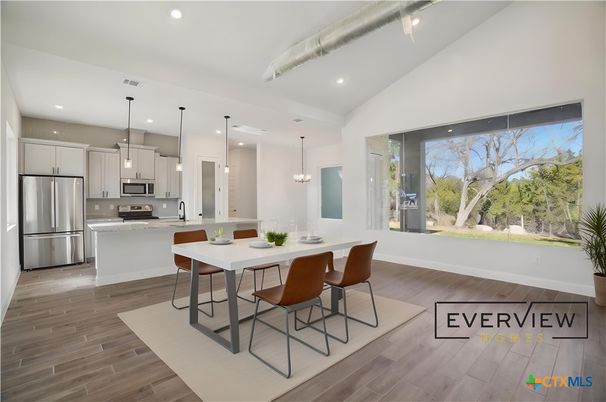 Dining room, Interior, Kitchen, Pendant Lights, Recessed Lighting, Stainless Steel Appliances, Wood Texture Flooring