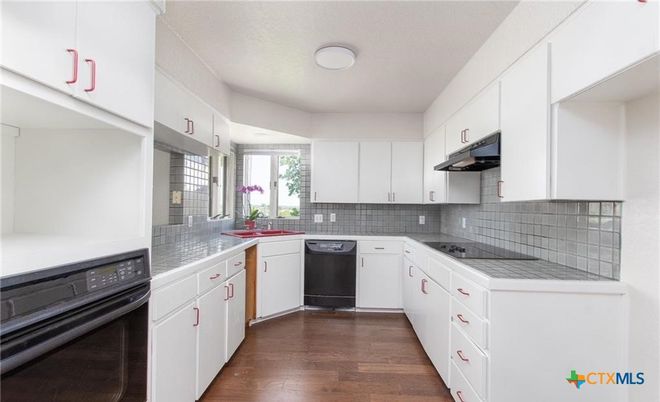 Interior, Kitchen, Tile Countertops, Wood Texture Flooring