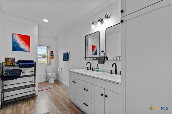 Bathroom, Dual Sink Vanities, Interior, Recessed Lighting, Wood Texture Flooring