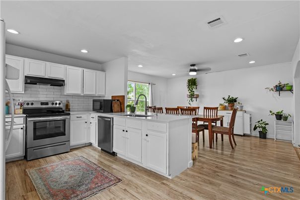 Dining room, Interior, Kitchen, Recessed Lighting, Stainless Steel Appliances, Wood Texture Flooring