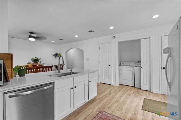 Interior, Kitchen, Recessed Lighting, Washer, Wood Texture Flooring