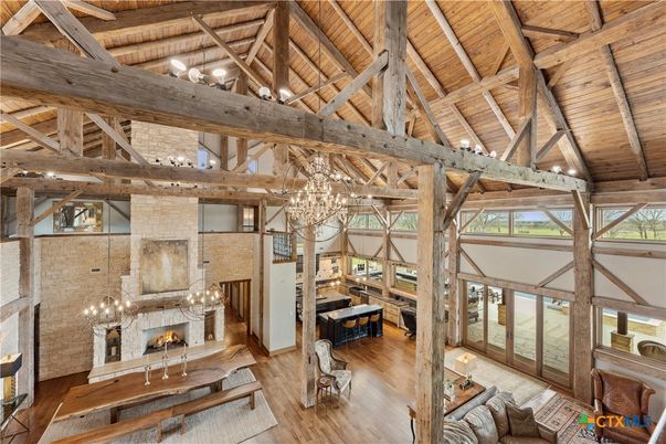 Chandelier, Fireplace, Interior, Living room, Stone Walls, Wooden Beams, Wooden Ceilings, Wood Texture Flooring