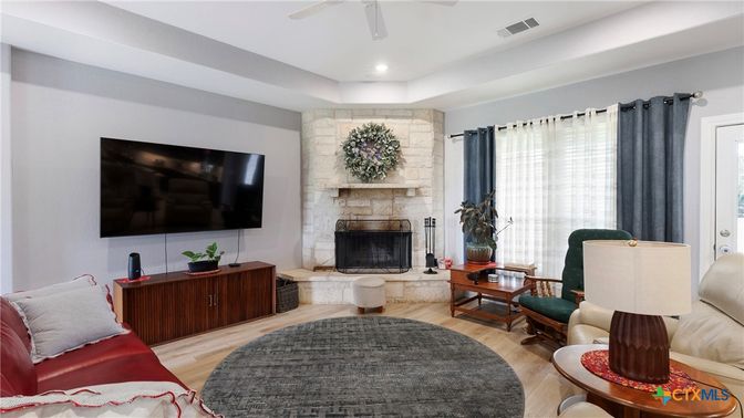 Fireplace, Interior, Living room, Recessed Lighting, Stone Walls, Wood Texture Flooring
