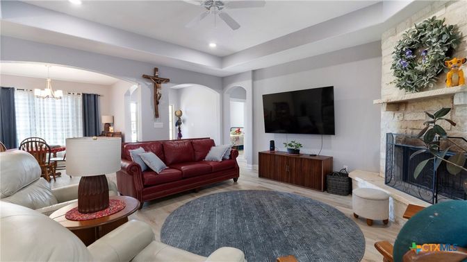 Chandelier, Dining room, Fireplace, Interior, Living room, Recessed Lighting, Stone Walls, Wood Texture Flooring