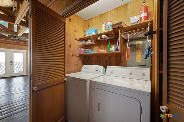 Interior, Utility Closets, Washer, Wood Texture Flooring, Wooden Walls