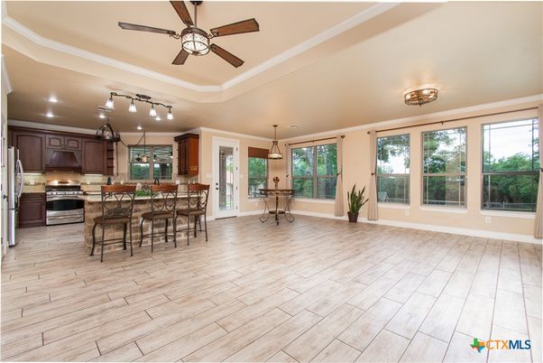 Dining room, Interior, Kitchen, Pendant Lights, Recessed Lighting, Stainless Steel Appliances, Wood Texture Flooring