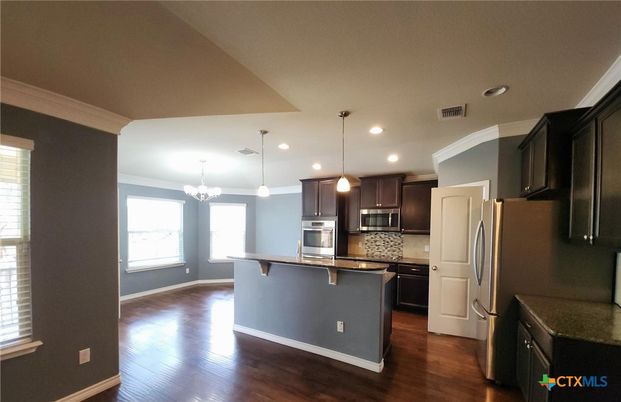 Chandelier, Interior, Kitchen, Pendant Lights, Recessed Lighting, Stainless Steel Appliances, Wood Texture Flooring