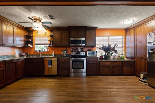 Interior, Kitchen, Recessed Lighting, Stainless Steel Appliances, Wood Texture Flooring