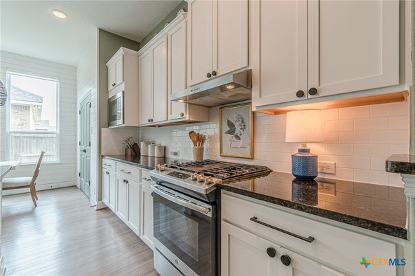 Dining room, Interior, Kitchen, Recessed Lighting, Stainless Steel Appliances, Wood Texture Flooring