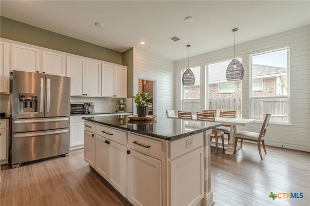 Dining room, Interior, Kitchen, Pendant Lights, Recessed Lighting, Stainless Steel Appliances, Wood Texture Flooring