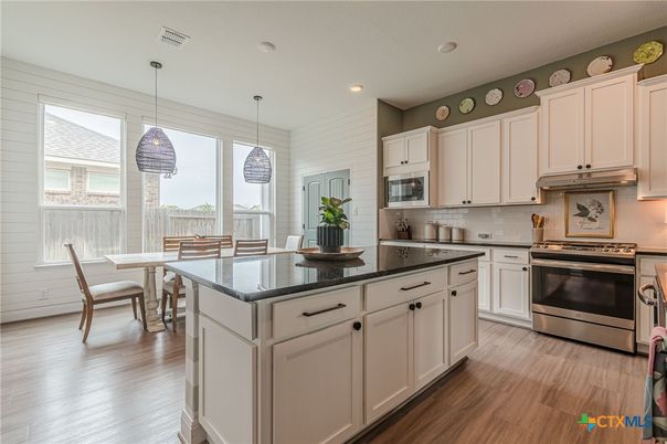 Dining room, Interior, Kitchen, Pendant Lights, Recessed Lighting, Stainless Steel Appliances, Wood Texture Flooring