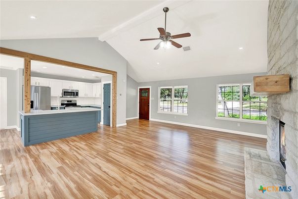 Fireplace, Interior, Kitchen, Recessed Lighting, Stainless Steel Appliances, Wood Texture Flooring