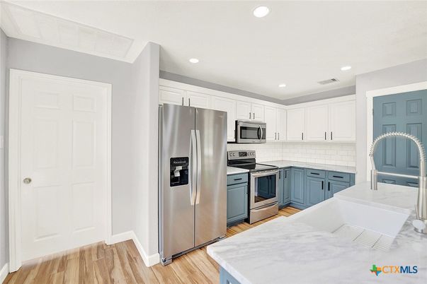 Interior, Kitchen, Recessed Lighting, Stainless Steel Appliances, Wood Texture Flooring