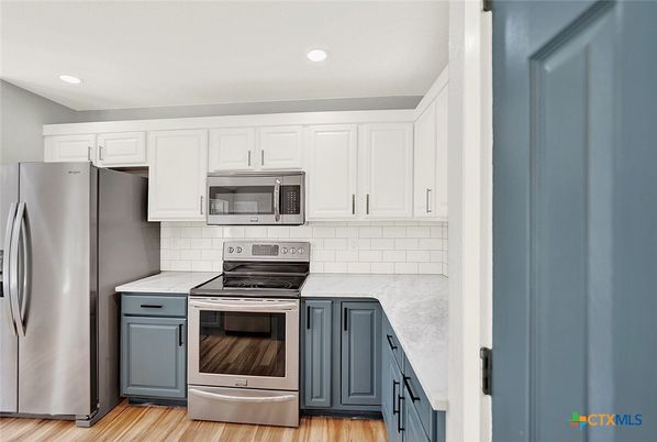 Interior, Kitchen, Recessed Lighting, Stainless Steel Appliances, Wood Texture Flooring