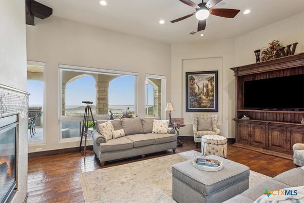 Fireplace, Interior, Living room, Recessed Lighting, Water, Wood Texture Flooring
