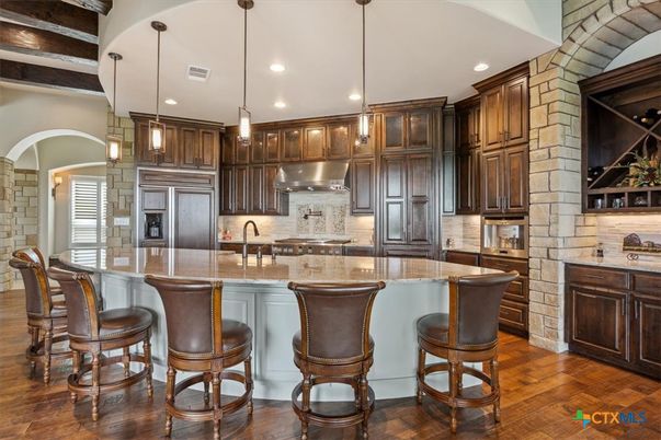 Interior, Kitchen, Pendant Lights, Recessed Lighting, Stainless Steel Appliances, Stone Walls, Wood Texture Flooring