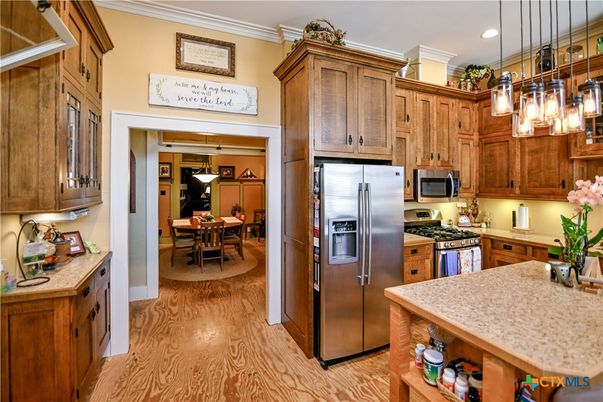 Dining room, Interior, Kitchen, Pendant Lights, Recessed Lighting, Stainless Steel Appliances, Wood Texture Flooring