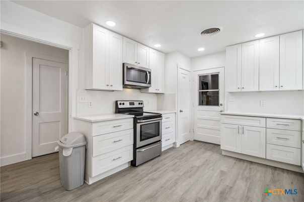Interior, Kitchen, Recessed Lighting, Stainless Steel Appliances, Wood Texture Flooring