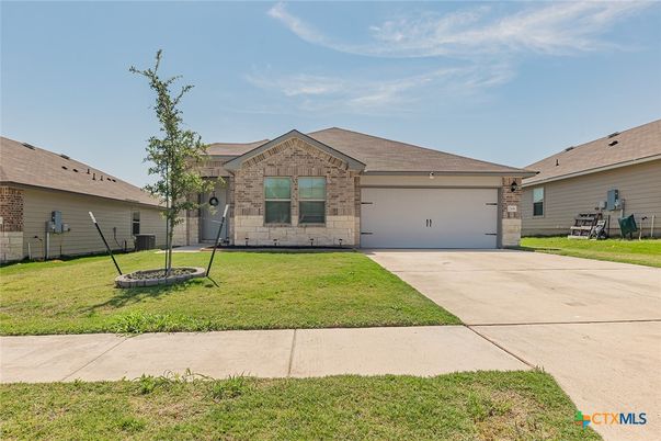 Attached, Backyard, Exterior, Facade, Brick Facade, Ranch