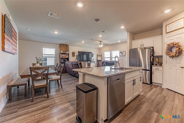 Dining room, Interior, Kitchen, Recessed Lighting, Stainless Steel Appliances, Wood Texture Flooring