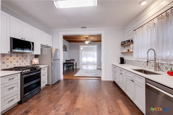 Dining room, Interior, Kitchen, Recessed Lighting, Stainless Steel Appliances, Wood Texture Flooring