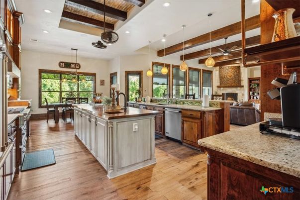Fireplace, Interior, Kitchen, Pendant Lights, Recessed Lighting, Stainless Steel Appliances, Wooden Beams, Wood Texture Flooring