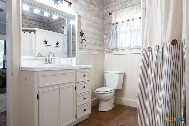 Bathroom, Interior, Tile Countertops, Wood Texture Flooring, Wooden Walls