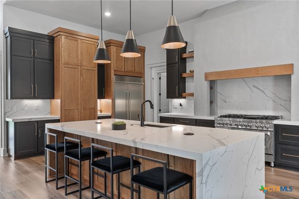 Interior, Kitchen, Marble Walls, Pendant Lights, Recessed Lighting, Stainless Steel Appliances, Wood Texture Flooring