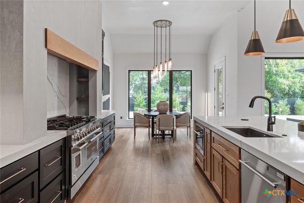 Dining room, Interior, Kitchen, Pendant Lights, Recessed Lighting, Stainless Steel Appliances, Wood Texture Flooring