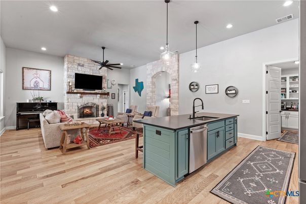Fireplace, Interior, Kitchen, Living room, Pendant Lights, Recessed Lighting, Stone Walls, Wood Texture Flooring