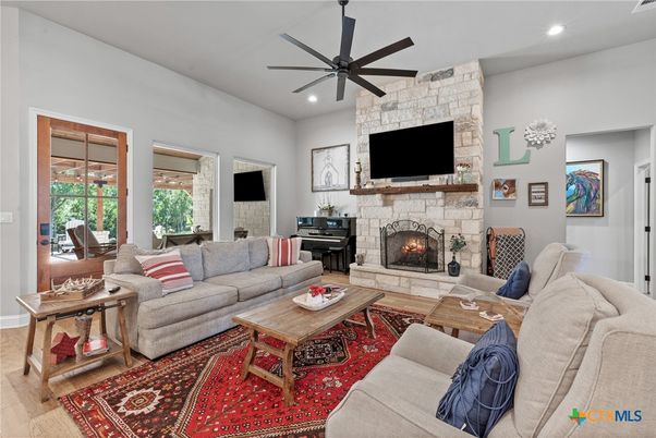 Fireplace, Interior, Living room, Recessed Lighting, Stone Walls, Wood Texture Flooring