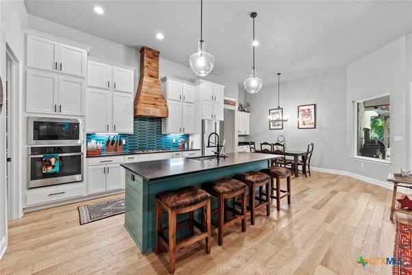 Dining room, Interior, Kitchen, Pendant Lights, Recessed Lighting, Stainless Steel Appliances, Wood Texture Flooring