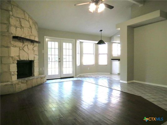 Empty room, Fireplace, Interior, Pendant Lights, Stone Walls, Wood Texture Flooring