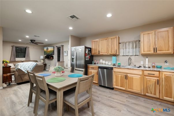 Dining room, Interior, Kitchen, Living room, Recessed Lighting, Stainless Steel Appliances, Wood Texture Flooring