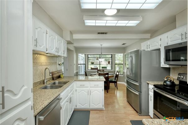 Dining room, Interior, Kitchen, Pendant Lights, Stainless Steel Appliances, Wood Texture Flooring