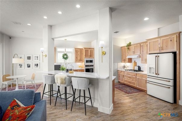 Dining room, Interior, Kitchen, Pendant Lights, Recessed Lighting, Stainless Steel Appliances, Wood Texture Flooring