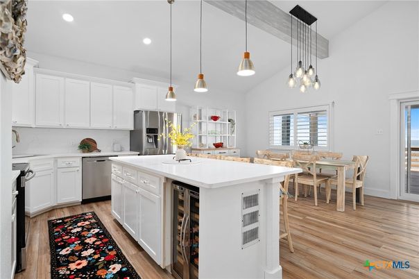Dining room, Interior, Kitchen, Pendant Lights, Recessed Lighting, Stainless Steel Appliances, Wood Texture Flooring