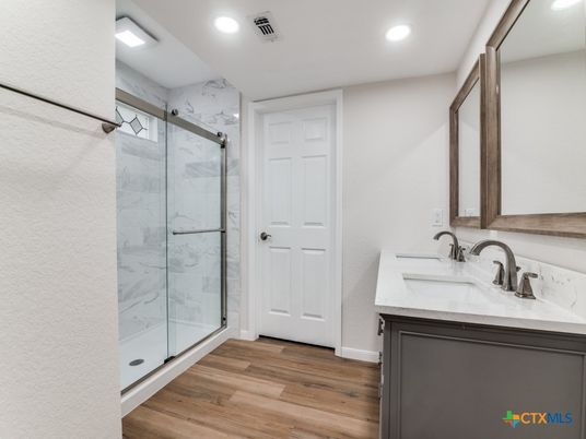 Bathroom, Glass Shower, Interior, Marble Walls, Recessed Lighting, Wood Texture Flooring