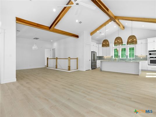 Chandelier, Empty room, Interior, Kitchen, Pendant Lights, Recessed Lighting, Stainless Steel Appliances, Wooden Beams, Wood Texture Flooring