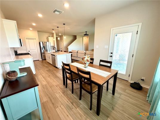 Dining room, Interior, Kitchen, Pendant Lights, Recessed Lighting, Stainless Steel Appliances, Wood Texture Flooring