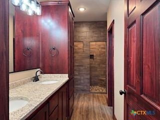 Bathroom, Dual Sink Vanities, Interior, Recessed Lighting, Wood Texture Flooring