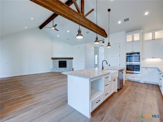 Empty room, Fireplace, Interior, Kitchen, Pendant Lights, Recessed Lighting, Wooden Beams, Wood Texture Flooring
