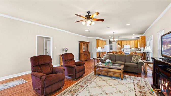 Chandelier, Fireplace, Interior, Kitchen, Living room, Pendant Lights, Recessed Lighting, Wood Texture Flooring