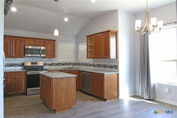 Chandelier, Interior, Kitchen, Pendant Lights, Recessed Lighting, Stainless Steel Appliances, Wood Texture Flooring