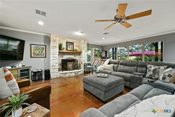 Fireplace, Interior, Living room, Recessed Lighting, Stone Walls, Wood Texture Flooring