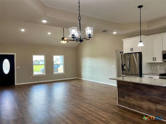 Empty room, Interior, Kitchen, Pendant Lights, Recessed Lighting, Stainless Steel Appliances, Wood Texture Flooring