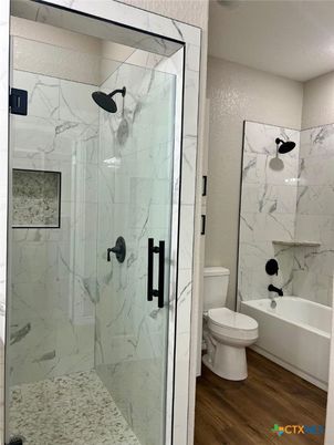 Bathroom, Glass Shower, Interior, Marble Walls, Wood Texture Flooring