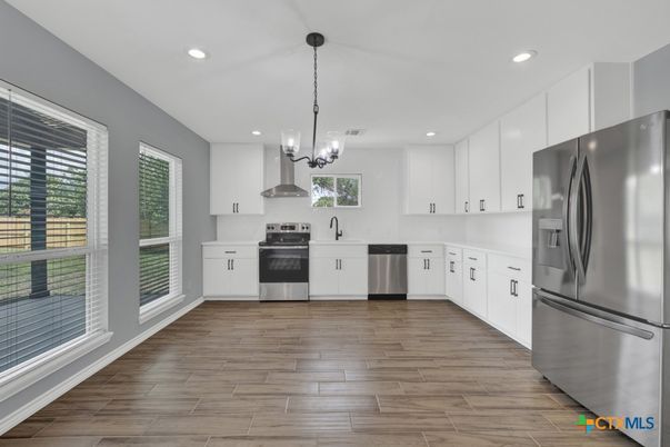 Chandelier, Interior, Kitchen, Pendant Lights, Recessed Lighting, Stainless Steel Appliances, Wood Texture Flooring