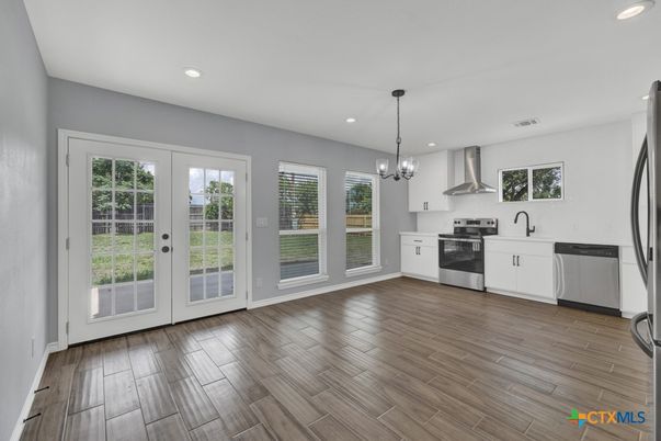Chandelier, Interior, Kitchen, Pendant Lights, Recessed Lighting, Stainless Steel Appliances, Wood Texture Flooring