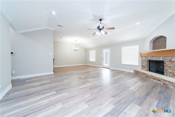 Chandelier, Empty room, Fireplace, Interior, Recessed Lighting, Wood Texture Flooring